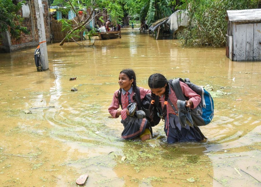 School students wade through a flood-affected area during the monsoon season in Patna, Bihar on September 03, 2026. (IANS Photo)