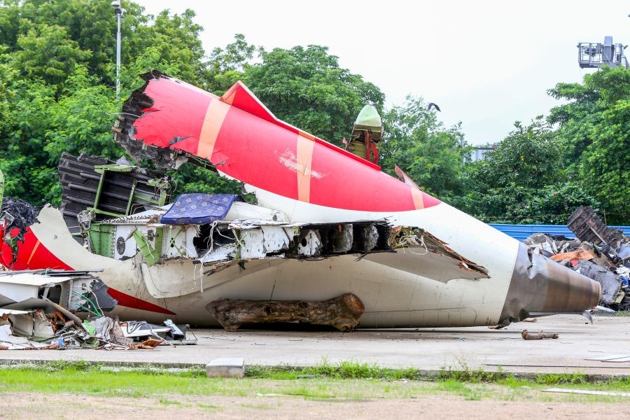 Wreckage and various parts of the Air India plane that crashed last month are seen under tight security at Sardar Vallabhbhai Patel International Airport in Ahmedabad on July 12, 2025. (IANS File Photo)