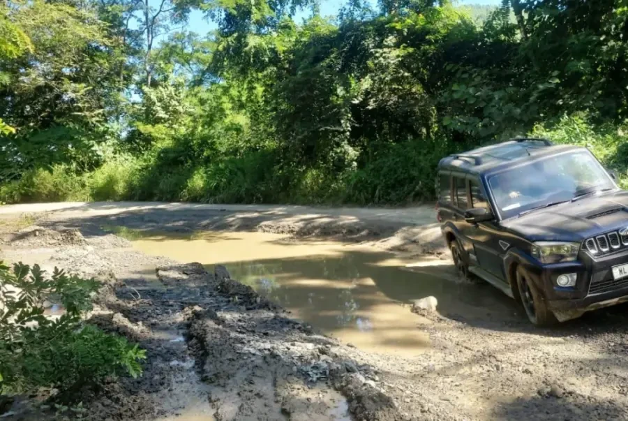Vehicle passes through the dilapidated portion of road along NH- 29 Kohima- Jessami in North Kikruma area on September 25. (Morung File Photo)