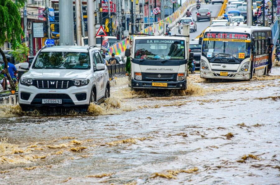 Vehicles wade through floodwater following heavy rain  at R G. Baruah Road in Guwahati on September 1, 2026. (IANS Photo)