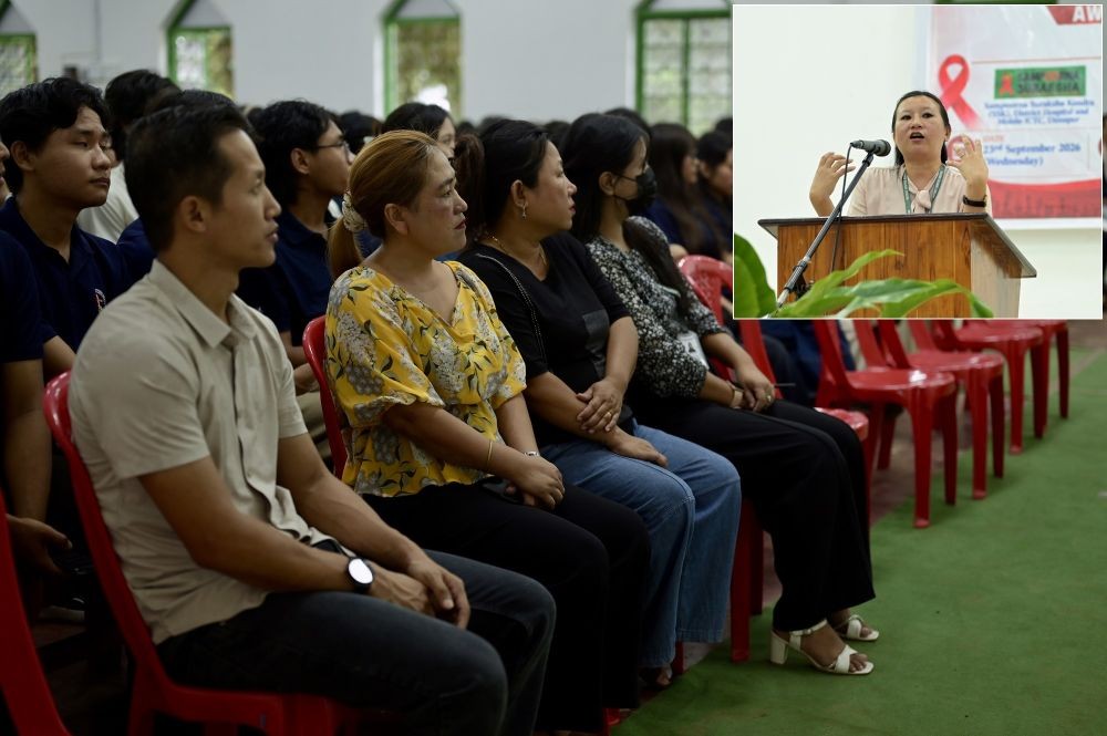 Faculty and students listen as Manager-cum-Counsellor, SSK, District Hospital, Dimapur, Pauramzeule (inset), addresses an HIV/AIDS Awareness and Testing Campaign at Patkai Christian College (Autonomous) on September 23. (Photo Courtesy: PCC)