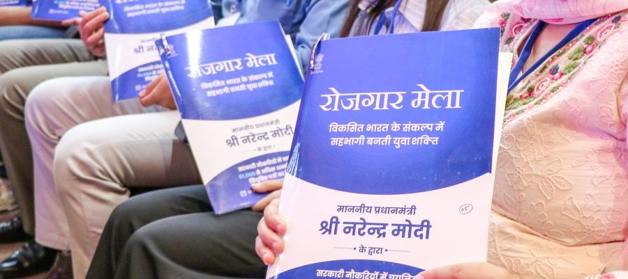 Youths pose with their appointment letters during the Rozgar Mela at the Convention Centre, in Jammu on May 23, 2026. (IANS File Photo)