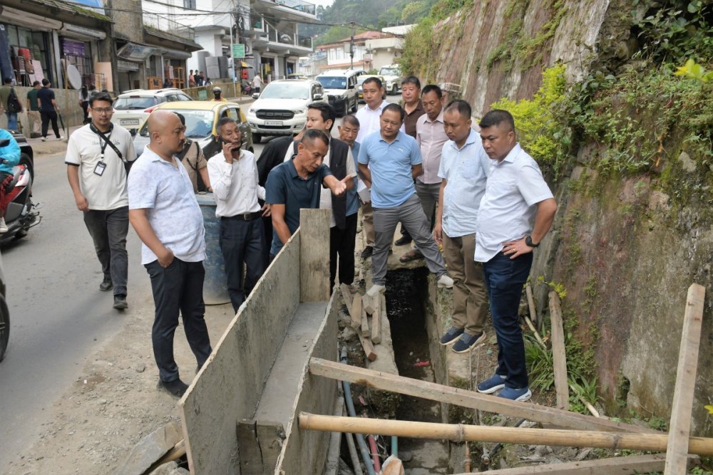 Deputy Commissioner of Kohima, B Henok Buchem, NCS, along with district officials and Midland Colony leaders, inspects the newly cleared 450-metre drain near the Kohima War Cemetery on September 28.