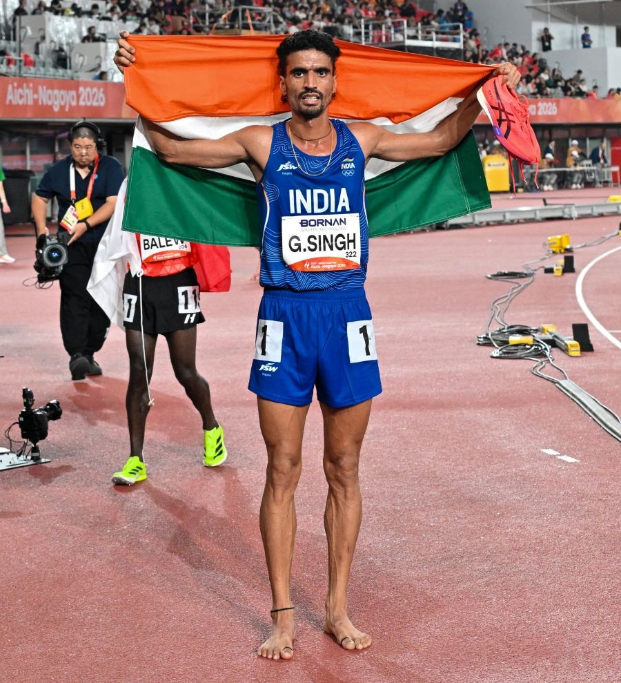 India’s Gulveer Singh celebrates with the national flag after winning the silver medal in the men’s 10,000m final at the 20th Asian Games Aichi-Nagoya 2026, in Nagoya, Japan, on September 25, 2026. (Photo: IANS/Biplab Banerjee)