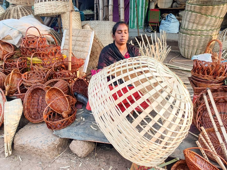 A woman prepares a bamboo basket from bamboo strips at a bamboo market on the eve of International Women’s Day in Jagdalpur, Bastar district, on March 7, 2026. (Photo: IANS)