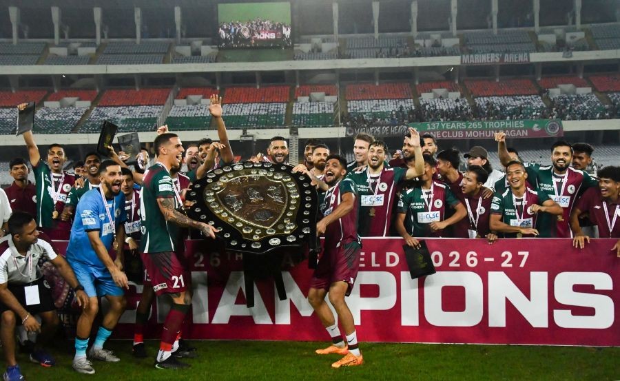 Mohun Bagan Super Giant players pose with the IFA Shield trophy after defeating East Bengal FC 1-0 in the final at Vivekananda Yuba Bharati Krirangan in Kolkata on October 08, 2026. (Photo: IANS/Kuntal Chakrabarty)