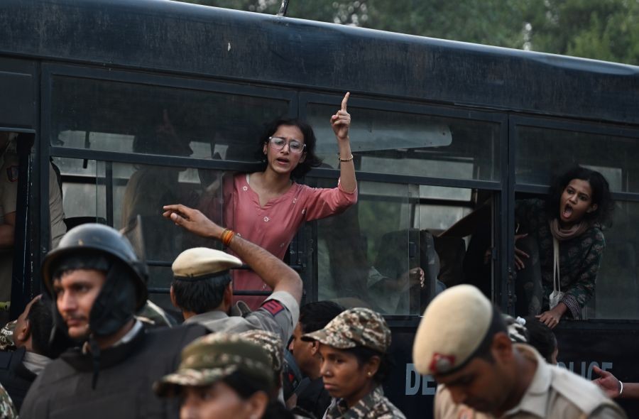 Security personnel detain protesters during a protest demanding the resignation of Chief Election Commissioner Gyanesh Kumar at INA in New Delhi on October 10, 2026. (Photo: IANS/Deepak Kumar)
