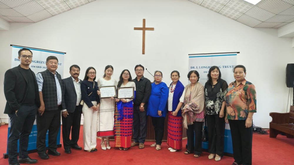 Dr I Longrizung Trust Award 2026 recipients Sentienla Jamir and Yashienla Pongen with family members of the late Dr Longrizung during the award presentation in Mokokchung on October 20. (Morung Photo)
