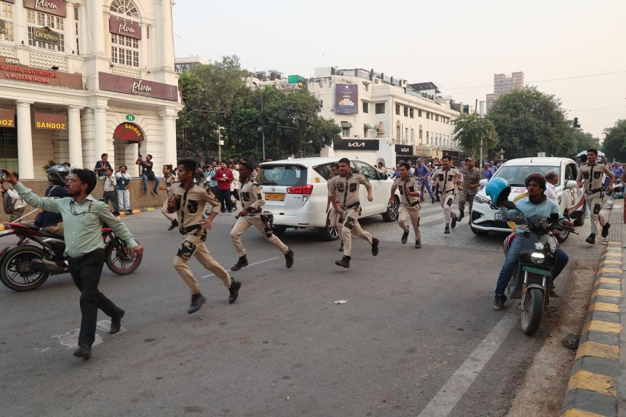 Delhi police personnel detain protesters during a demonstration demanding the resignation of Chief Election Commissioner Gyanesh Kumar at Connaught Place in New Delhi on October 10, 2026. (Photo: IANS/Prem Nath Pandey)