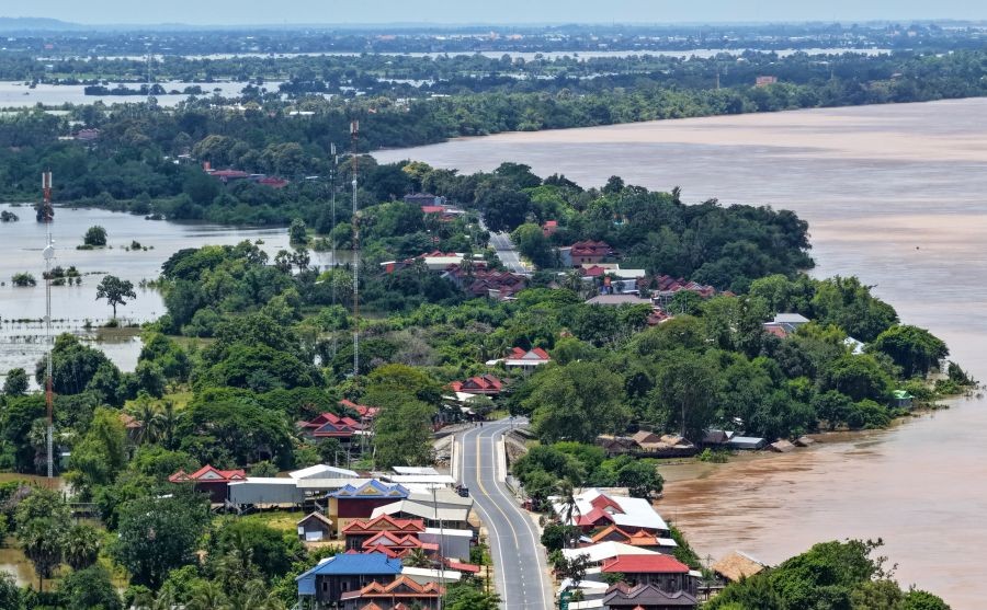 An aerial drone photo taken on Aug. 24, 2026, shows an area affected by the flooding of the Mekong River in Kratie province, Cambodia. The flooding of the Mekong River has affected 13,688 families across four Cambodian provinces, forcing 1,551 families to evacuate to higher ground, a disaster control spokesperson said Tuesday. Soth Kim Kolmony, spokesperson for the National Committee for Disaster Management (NCDM), said Kratie, Tboung Khmum, Stung Treng, and Kampong Cham provinces have faced severe flooding since last Friday, triggered by the aftermath of Typhoon Saudel. (Photo: Xinhua via IANS)
