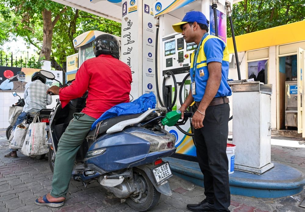 New Delhi: A petrol pump worker fills fuel into a vehicle after petrol and diesel prices were hiked by Rs 3 per litre each, the first increase in over four years, amid rising global crude oil prices, in New Delhi on Friday, May 15, 2026. (Photo: IANS/Deepak Kumar)