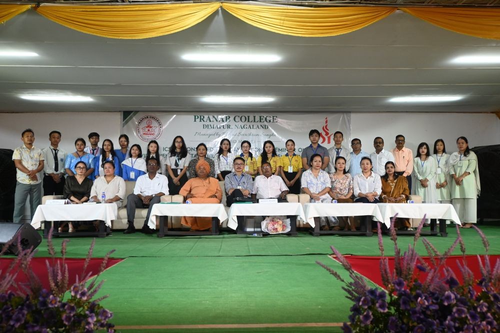 Dignitaries, faculty, and participants pose for a photograph during the national seminar on environmental sustainability at Pranab College, Dimapur.