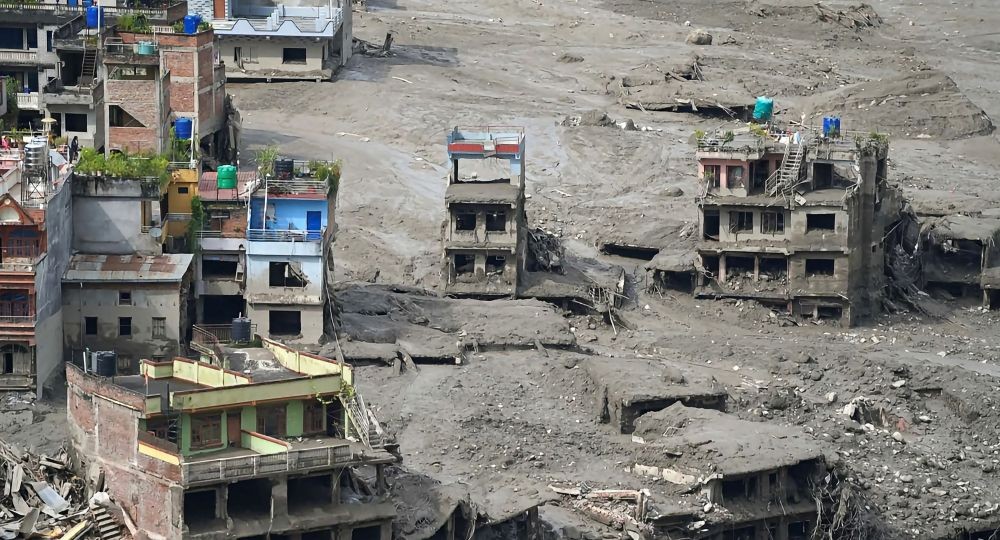 Houses damaged by floodwaters following flooding in the Beni Ghat area of Dhading district, Nepal, on August 26, 2026. (Photo: IANS)