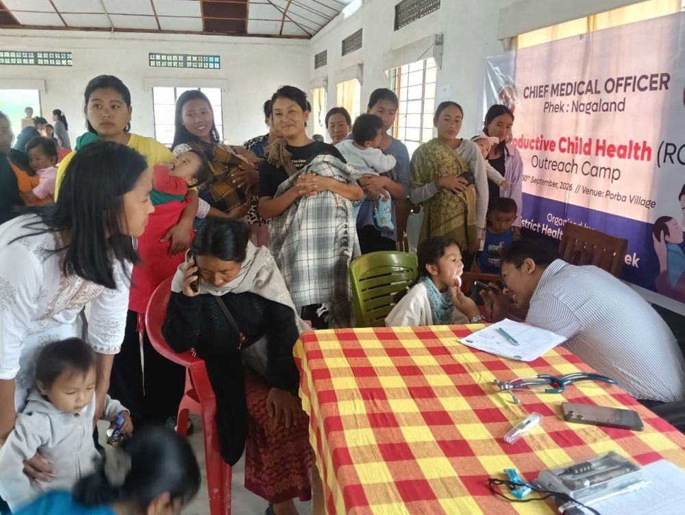 Dr Kedoneilhou, Paediatrician, District Hospital Phek, examines a patient during the RCH outreach camp at Porba.